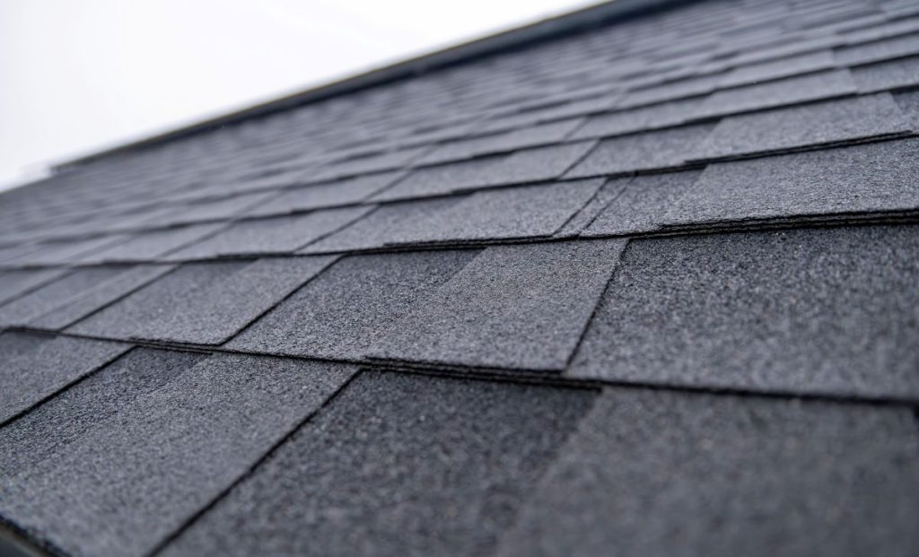 Close-up of dark grey architectural shingles